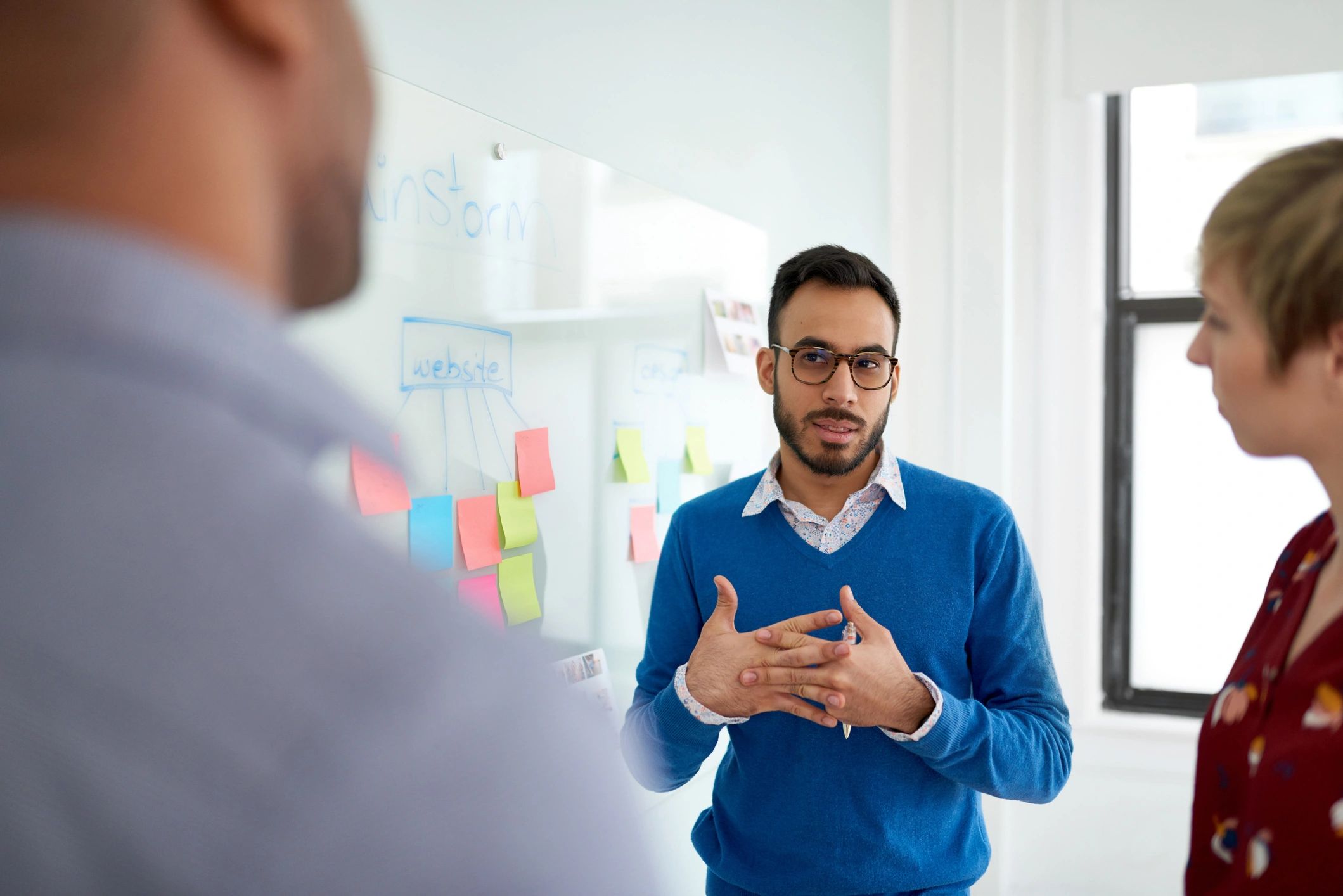 Diverse consulting team collaborating during a strategy session