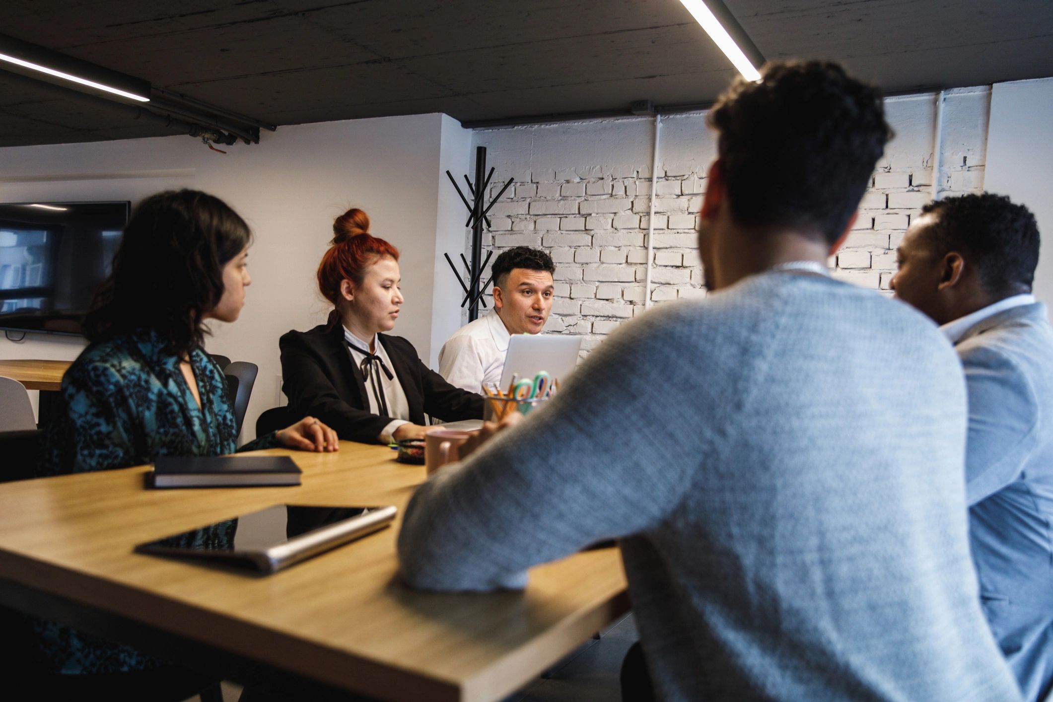 International team meeting around a conference table