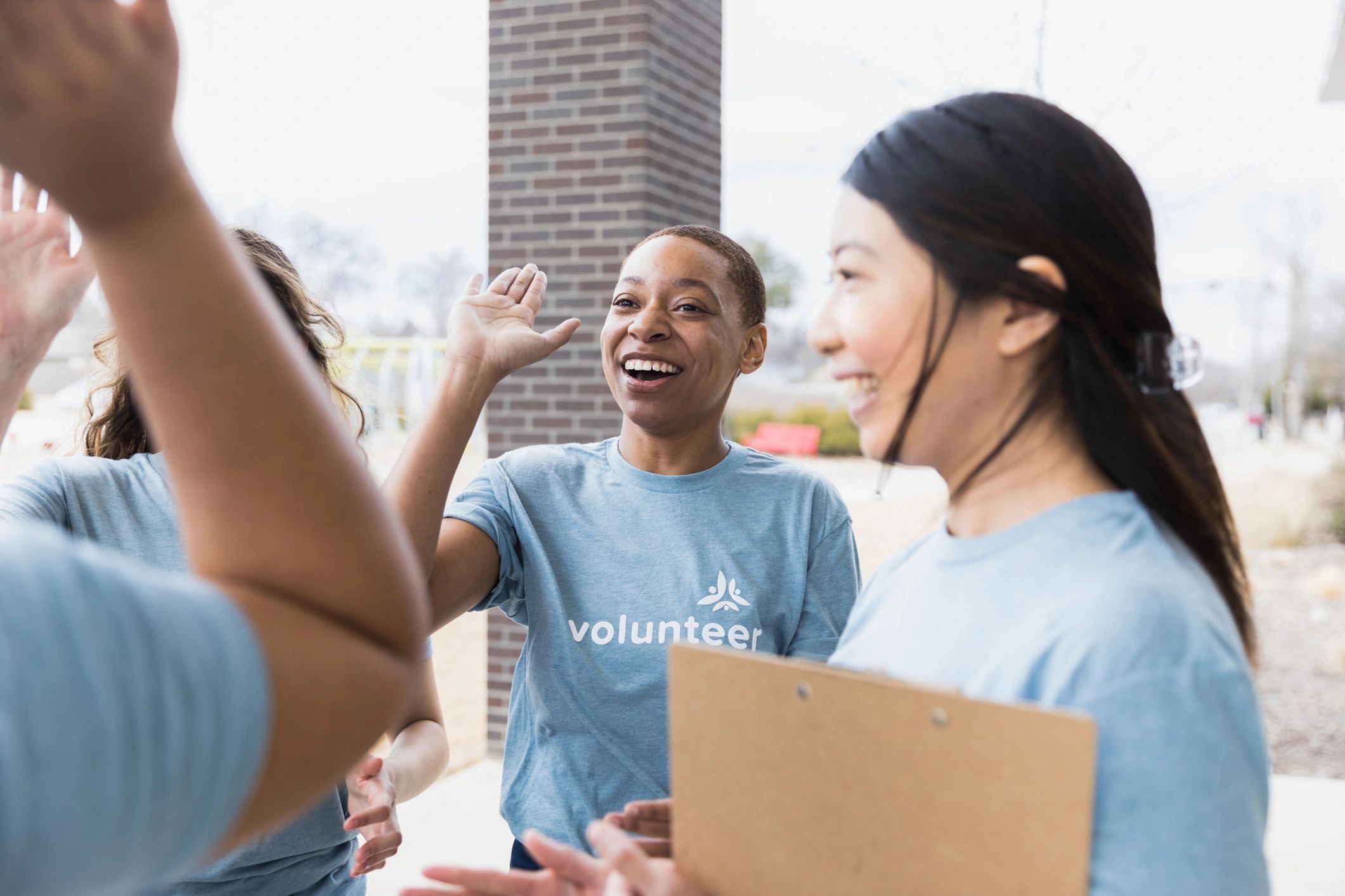 Young adults celebrating progress at an event