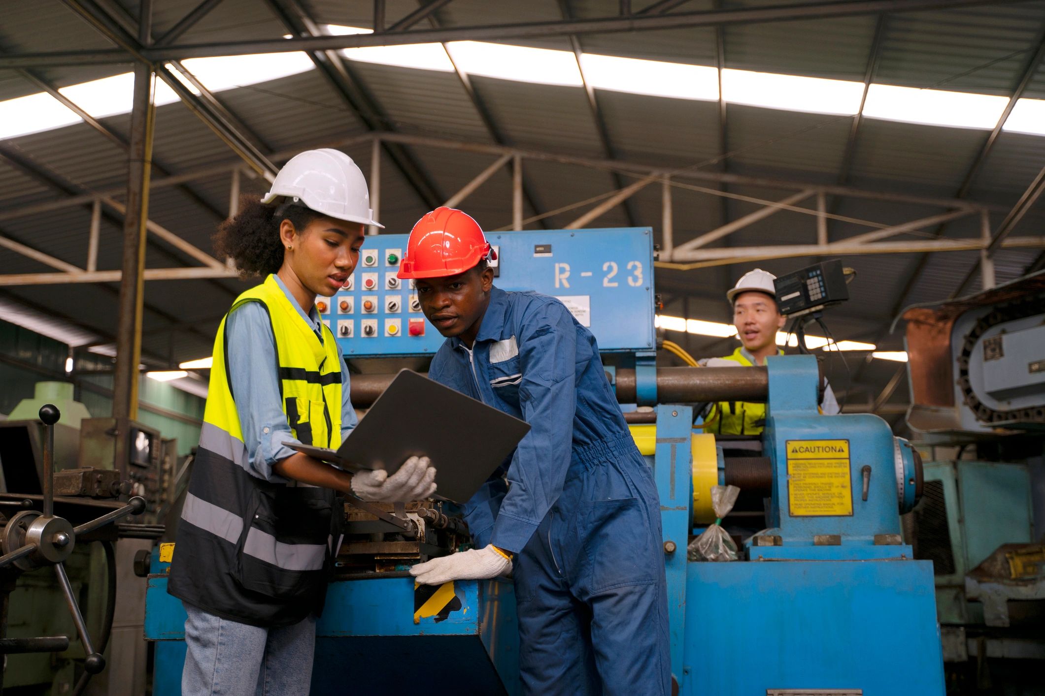 Manufacturing professionals collaborating in a factory environment
