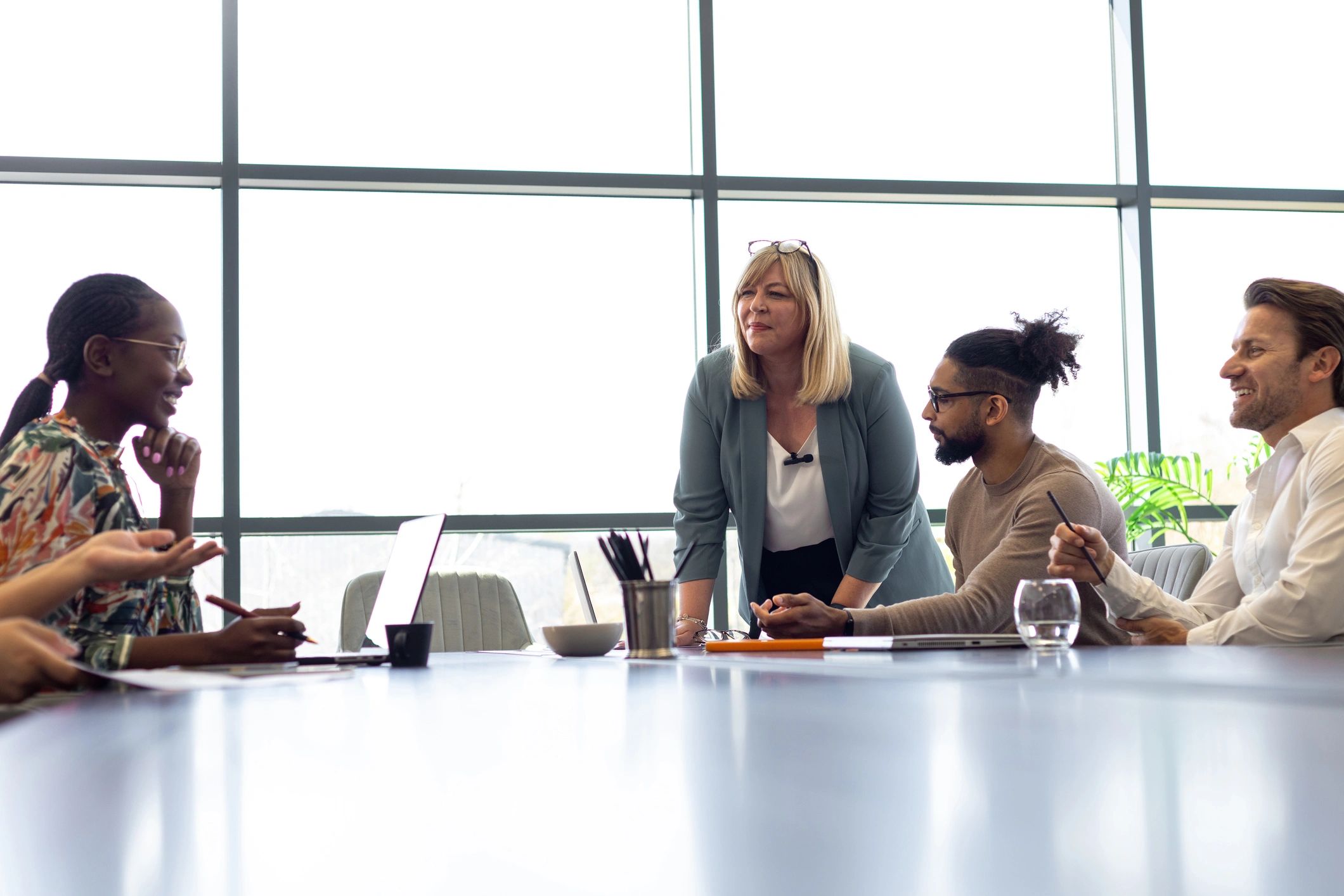 Business leaders reviewing reports in a modern conference room