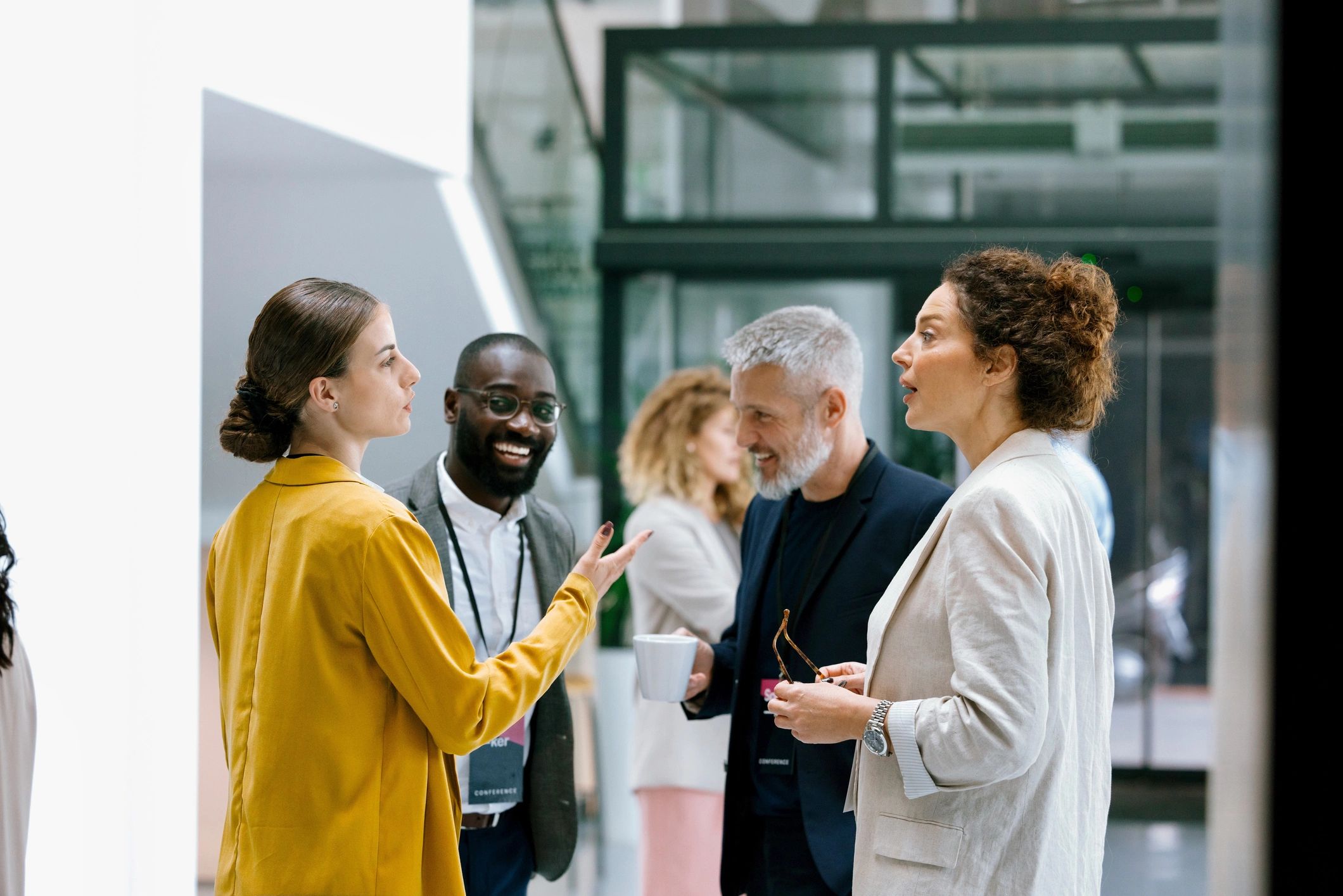 Leadership professionals in discussion at a business conference