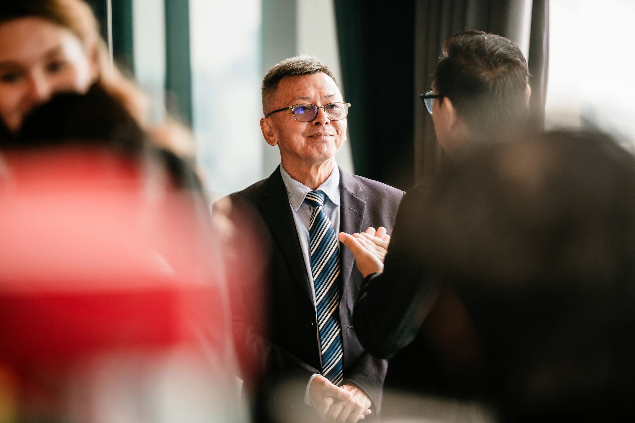 Senior business leader networking at a corporate event