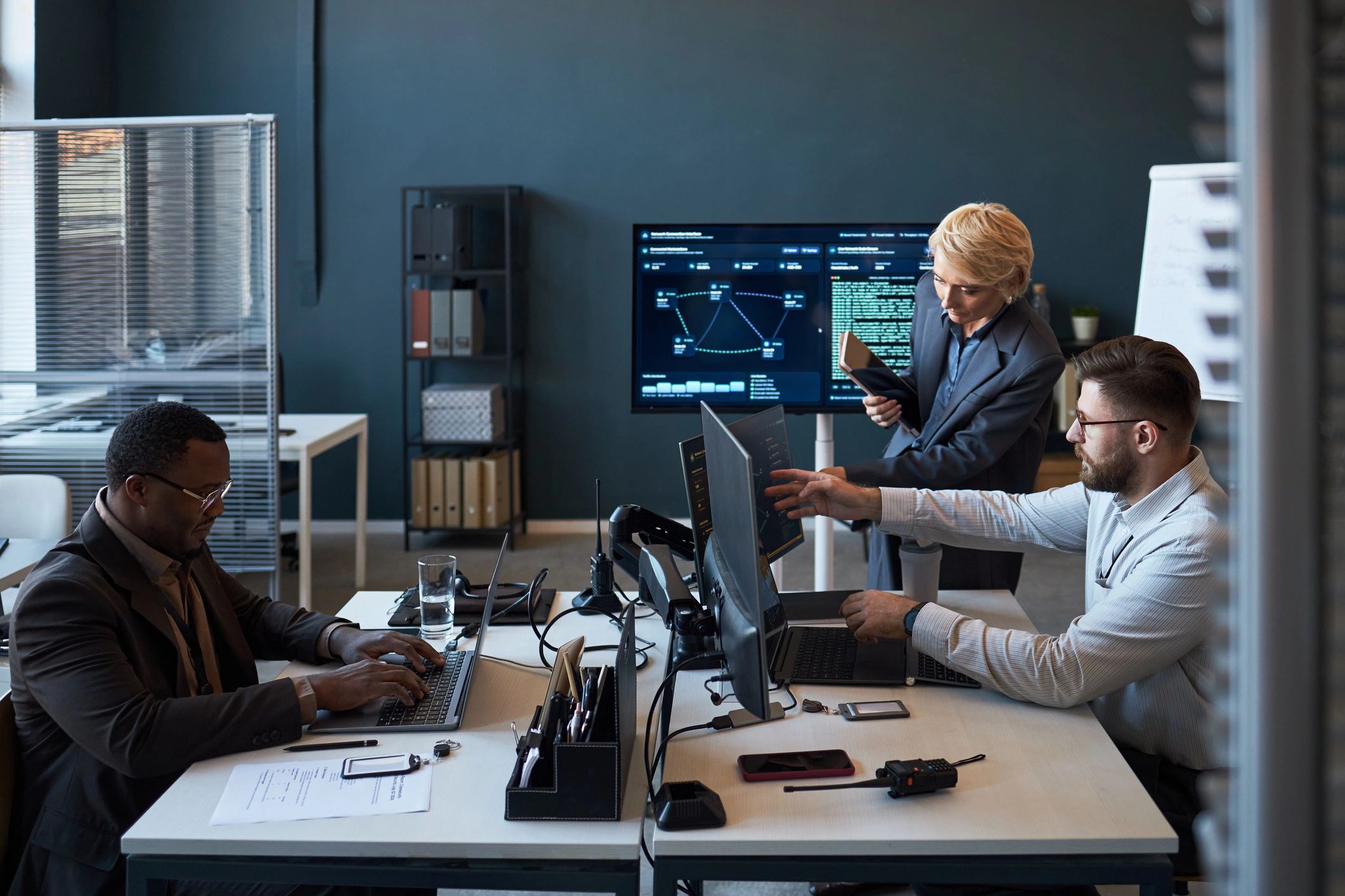 Team reviewing data dashboards in an office
